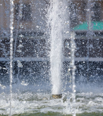 Splashes of water in the fountain in the park