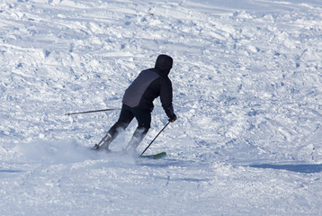 Man skiing in the snow in winter