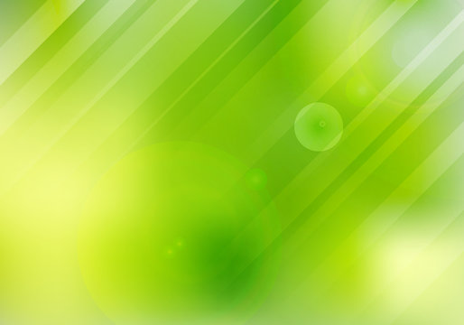 Abstract green nature blurred background with lens flare and lighting.