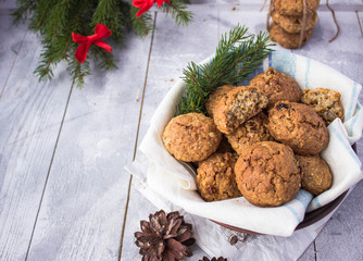 homemade oatmeal cookies on a wooden grey table free space for text - holidays, winter, celebration,  Christmas and  new year concept 