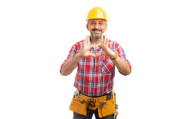 Builder holding heart symbol with fingers.