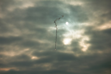 The missile fly on city at dramatic sky