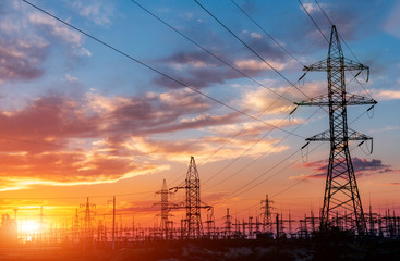 Fototapeta premium High-voltage power lines. Electricity distribution station. high voltage electric transmission tower. Distribution electric substation with power lines and transformers