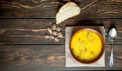 soup with mushrooms on a wooden table
