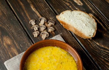 soup with mushrooms on a wooden table