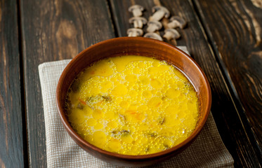 soup with mushrooms on a wooden table