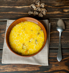 soup with mushrooms on a wooden table