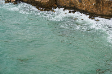 Obraz premium Waves and Rocks Background