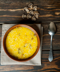 soup with mushrooms on a wooden table