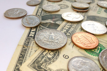 Close up American quarter, dime and penny coins on two dollars usa background