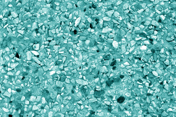 Pile of small gravel stones in cyan tone.