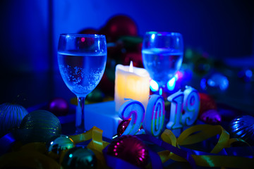 Glasses of champagne and new year decorations