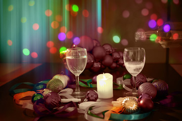  glasses of champagne with a Christmas decor in the background