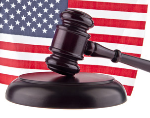 US flag and wooden hammer isolated on white background
