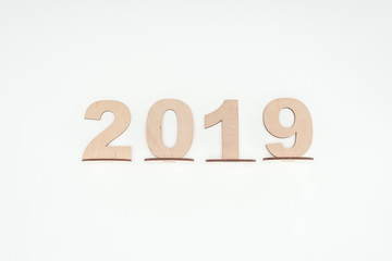 top view of wooden numbers with 2019 date isolated on white