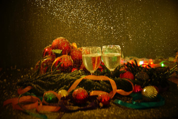 Two glasses of champagne with a Christmas decor in the background