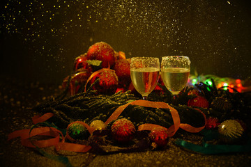 Two glasses of champagne with a Christmas decor in the background