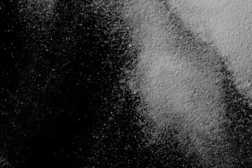 Fototapeta na wymiar Crystal salt isolated on black background, top view