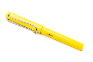 yellow modern fountain pen isolated on white, close up