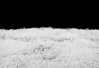 white snow on a black background