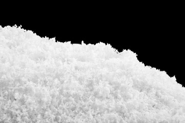 white snow isolated on black background