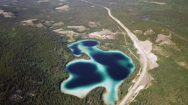 Aerial Forward Slow Tilt Down: Unique Lake in Canada