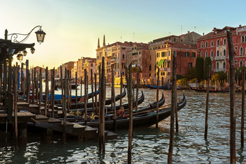 Fototapeta na wymiar Beautiful view of Venice in the sunset sunlight.Venetian houses and gondolas at sunset.