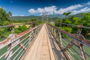 Wooden bridge over Nam Song river near Vang Vieng, Laos.