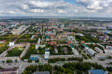 Tyumen, Russia - August 25, 2015: Aerial view on urban quarters. Space cinema house and building of Savings Bank. Respubliki and Tulskaya streets