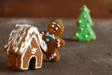 Gingerbread man on a wooden background.