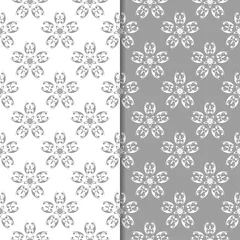 Schilderijen op glas White and gray floral ornaments. Set of seamless backgrounds © Liudmyla