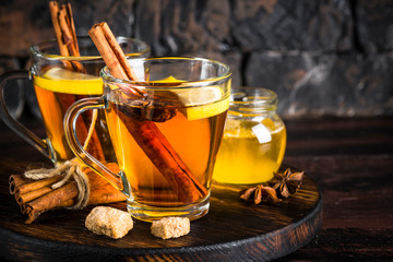 Autumn hot tea with lemon and spices