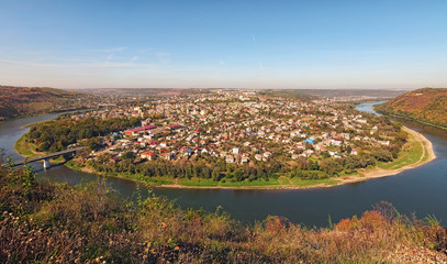 Fototapeta na wymiar Scenic autumn landscape panorama of Ukrainian town Zalishchyky and Dniester River. Ternopil region, Ukraine