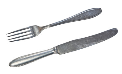 Top view of old silver fork and knife isolated on a white background