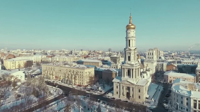 Kharkiv, Ukraine - Dec 13, 2016: Aerial of urban landscape covered with snow, orthodox church Uspenkii Sobor. city buildings in winter