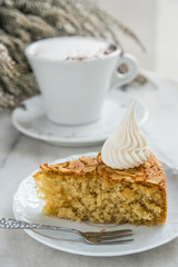 Slice of almond cake and coffee