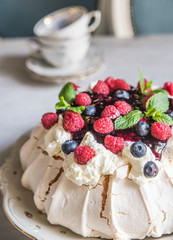 Meringue cake with berries in vintage style