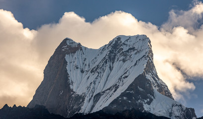 Summit of Machapuchare ( Fish Tail) against the clouds, Himalayas