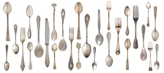 Collection vintage spoons, forks and knife isolated on a white background. Retro silverware.