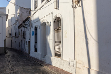 Fototapeta na wymiar view of a narrow street in spanish city cadiz