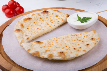 Traditional uzbek fried cheburek dough