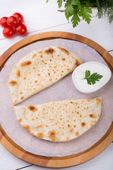 Traditional uzbek fried cheburek dough