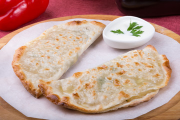 Traditional uzbek fried cheburek dough