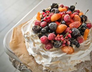 Meringue cake with fruit. Copy space