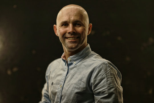 Young Bald Guy Portrait In Studio