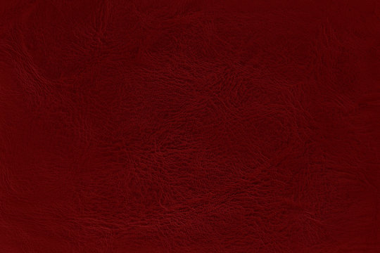 Close up of red leather texture background with seamless pattern.