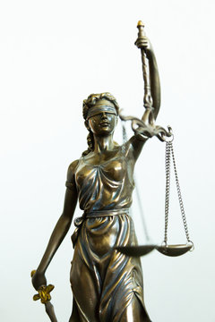 Justitia statue with blindfold, sword and balance