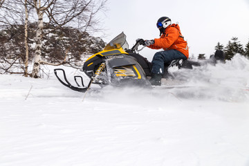 Athlete on a snowmobile.