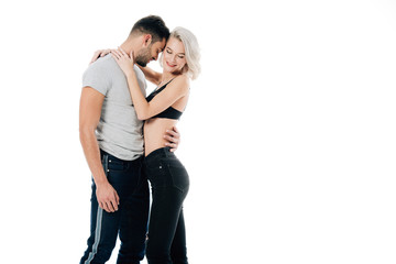 smiling heterosexual couple hugging isolated on white