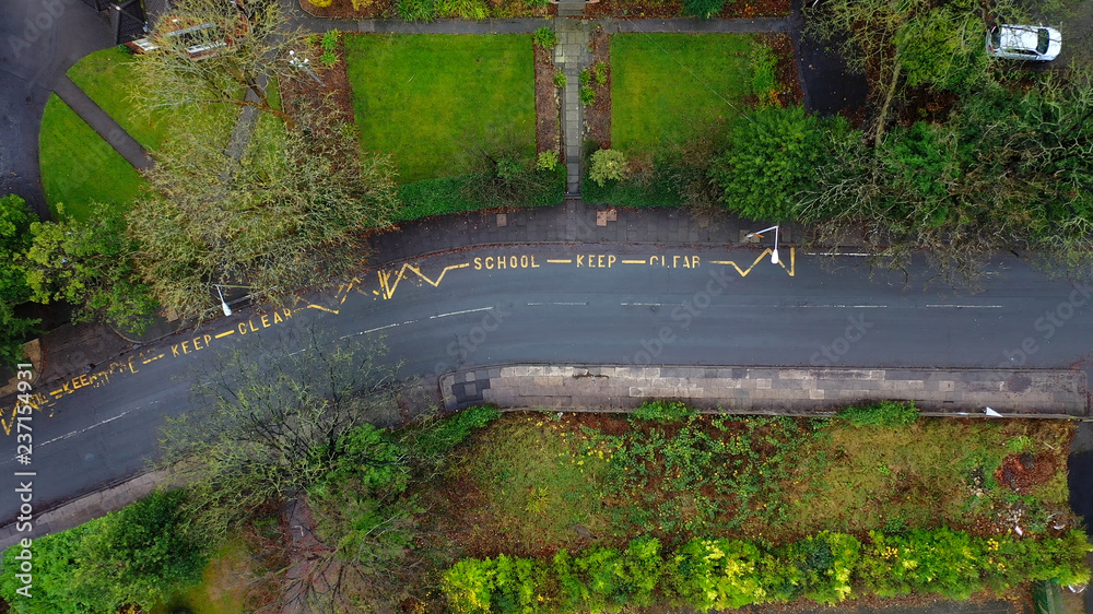 Wall mural aerial view of a school keep clear road sign in the uk